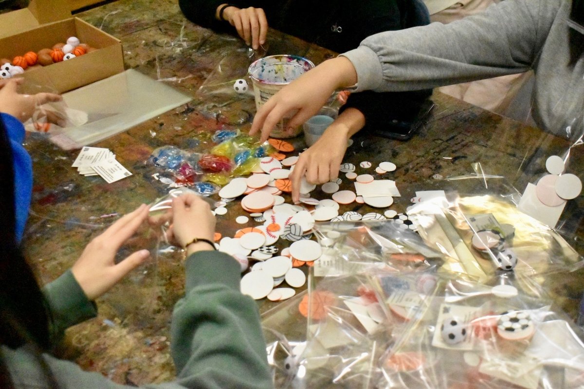 Members assembling the physical-activity kit pieces