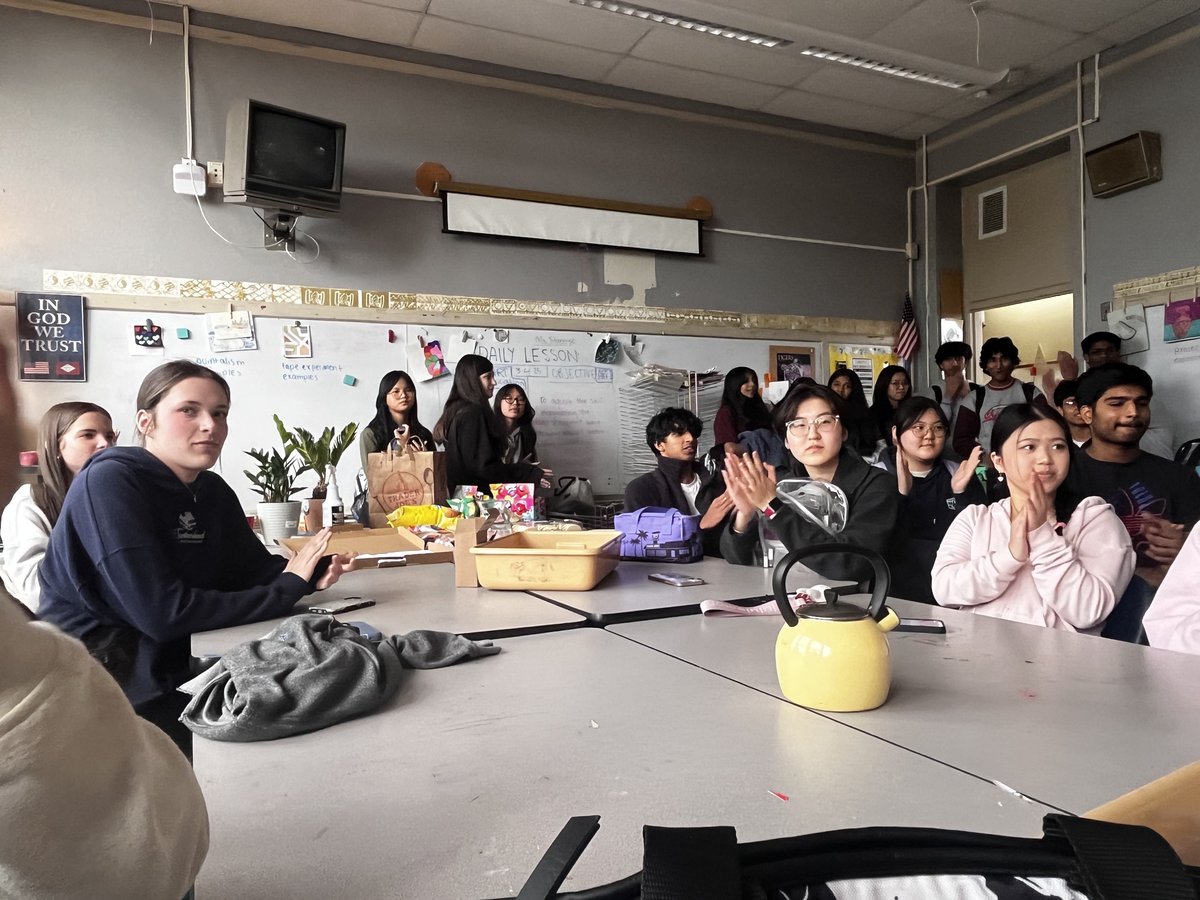 Members watching and reacting during the meeting
