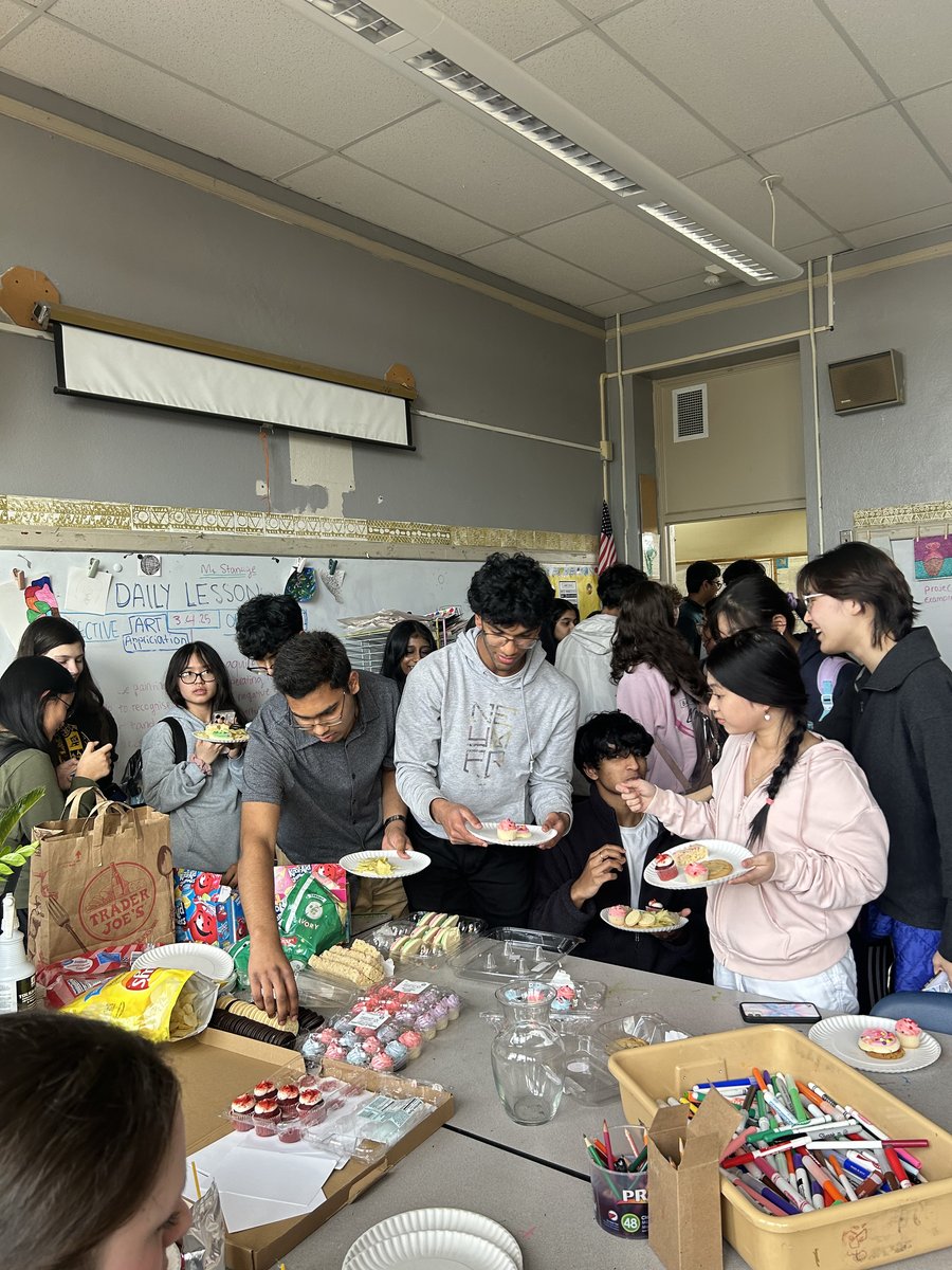 Members enjoying snacks and goody bags after the presentation