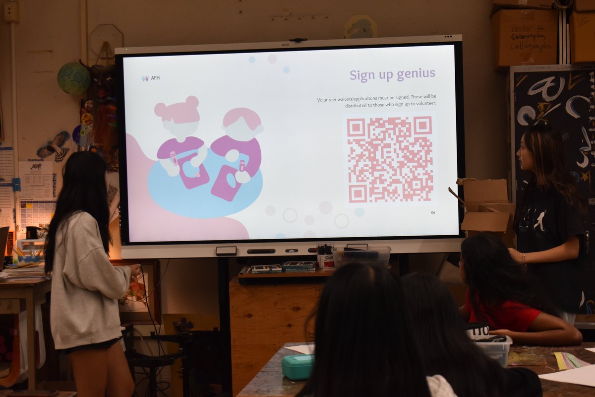 Presenter showing the volunteer sign-up slide