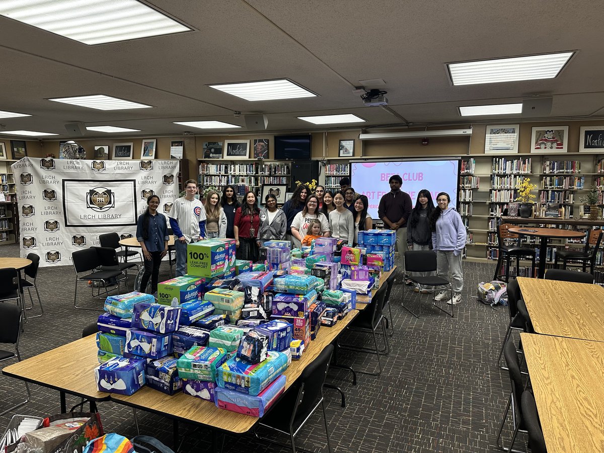 Members gathered with the collected period product donations